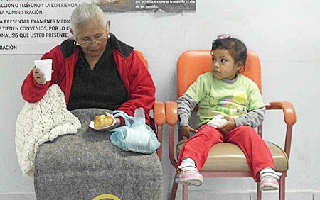 Enjoying a meal at the Christmas fiesta at the clinic