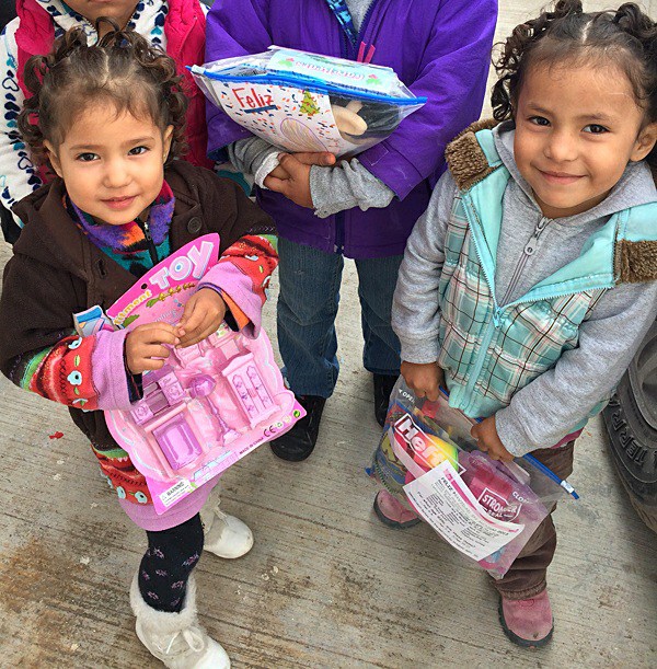 Kids excited with their gifts at the Christmas fiesta in Mexico Kids excited with their gifts at the Christmas fiesta in Mexico