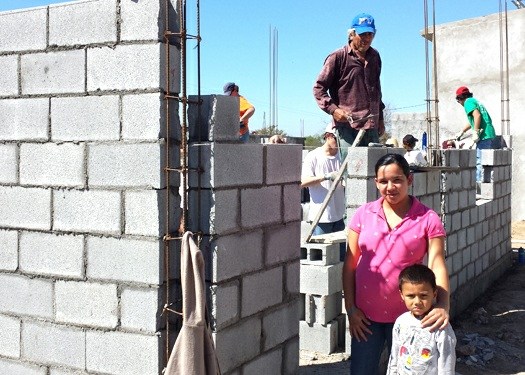 A family whose house is being built in Mexico