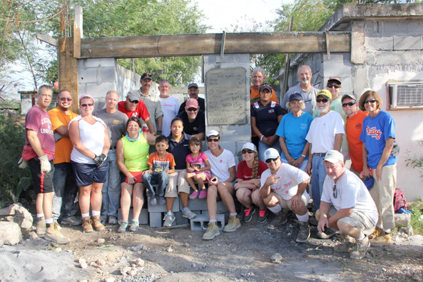 A mission work group with a family finishing up a house in Reynosa A mission work group with a family finishing up a house in Reynosa