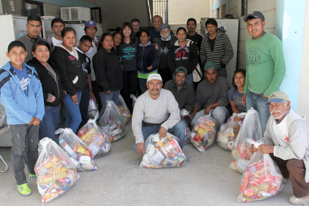 Volunteers and staff with their Christmas groceries in Reynosa Volunteers and staff with their Christmas groceries in Reynosa