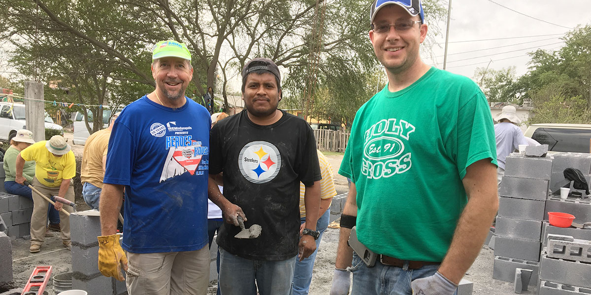 Friends laying block together in Reynosa