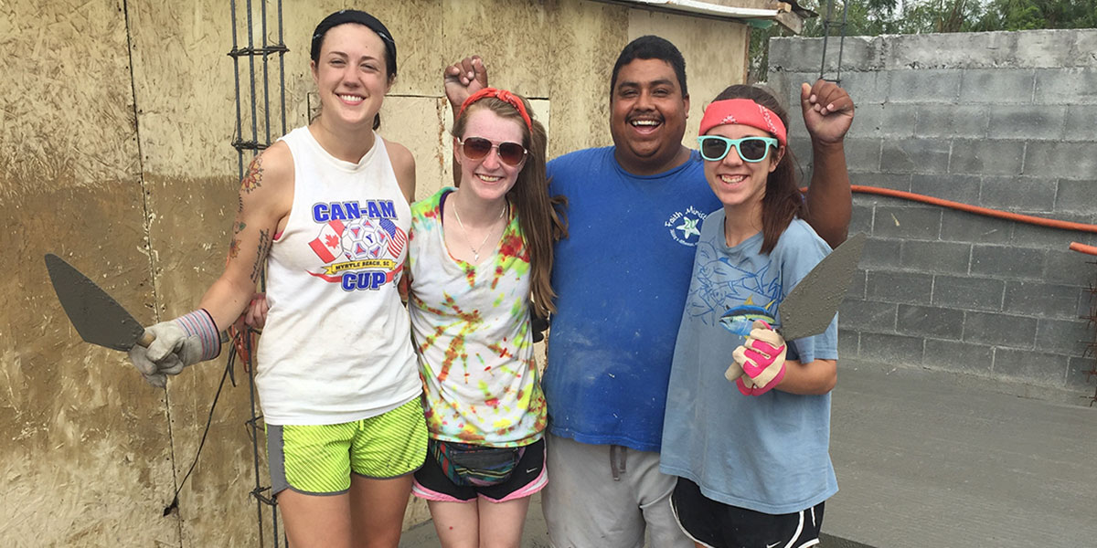 Friends in Reynosa hard at work pouring the floor of a house