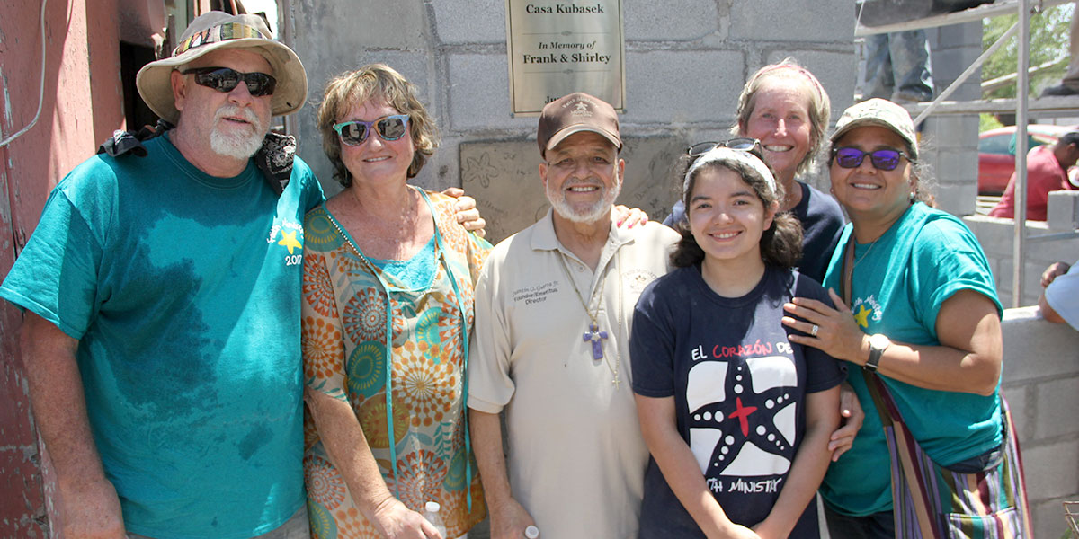 Deantin and his family and friends in front of a completed house in Reynosa Deantin and his family and friends in front of a completed house in Reynosa