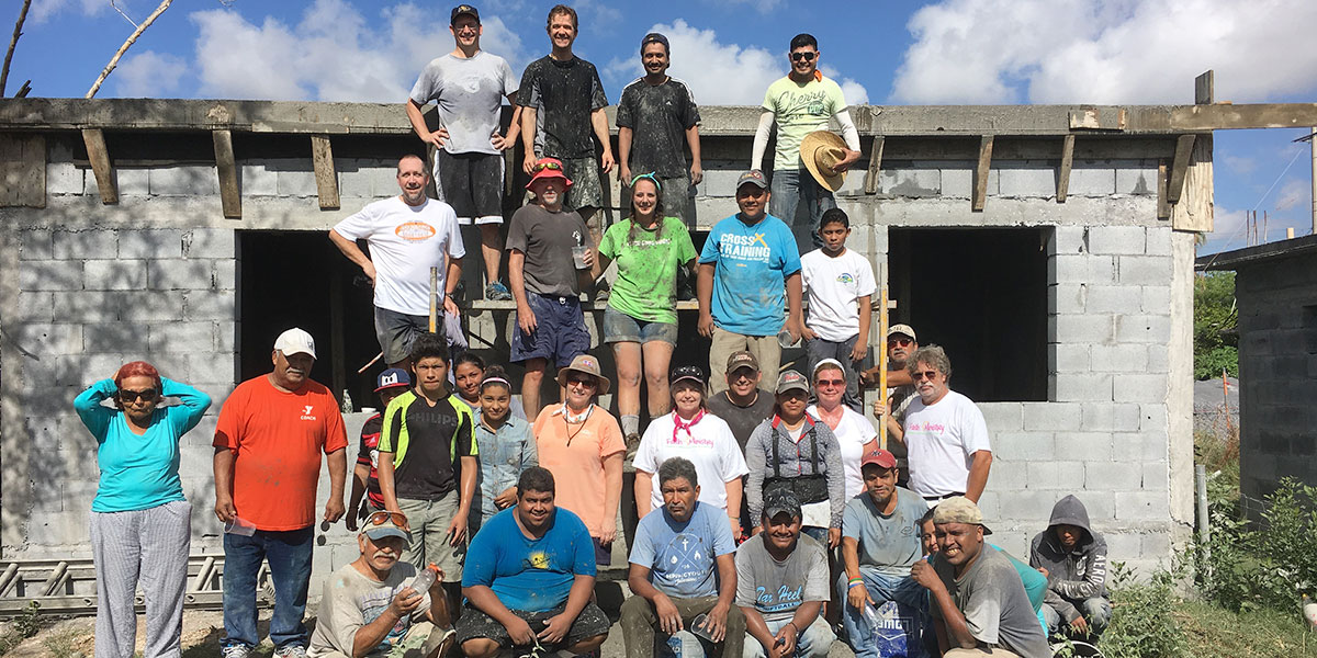 The Board of Directors with the staff and volunteers after pouring a roof in Reynosa