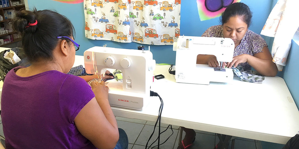 Women learning to sew in the sewing program in Reynosa