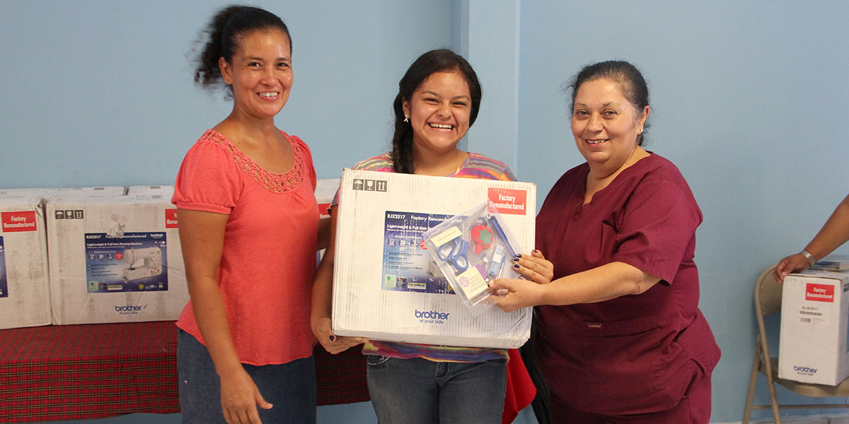 Ladies from the sewing program receiving sewing machines in Reynosa