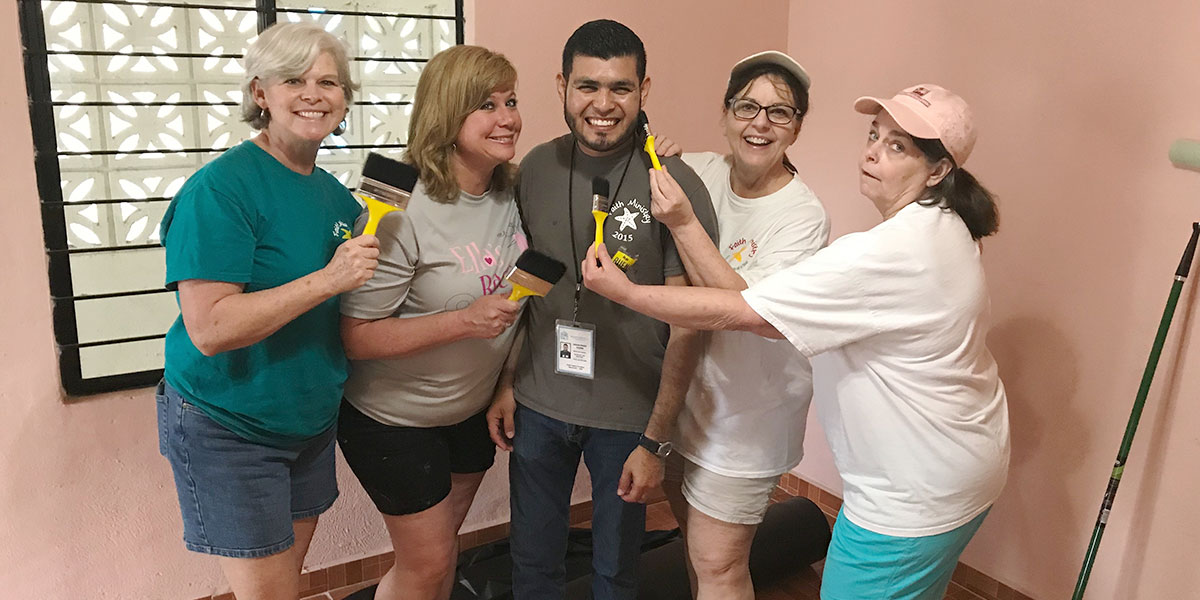 The Board of Directors giving Carlos pastoral house a fresh coat of paint