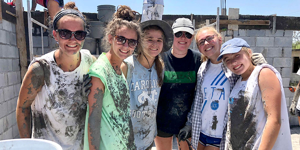 Girls from Grace Raleigh in North Carolina working to build a house in Reynosa
