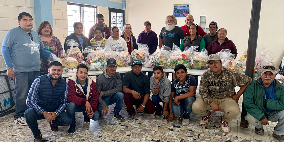 Volunteers in Reynosa with their grocery packages