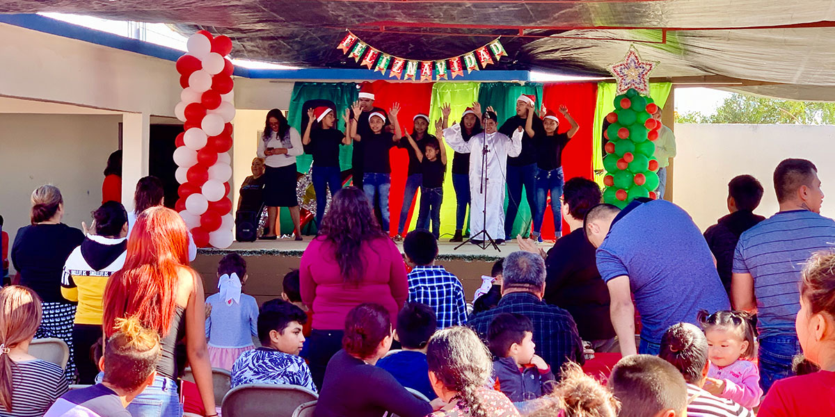 The youth from the church performing a song at the Christmas fiesta in Miguel Aleman