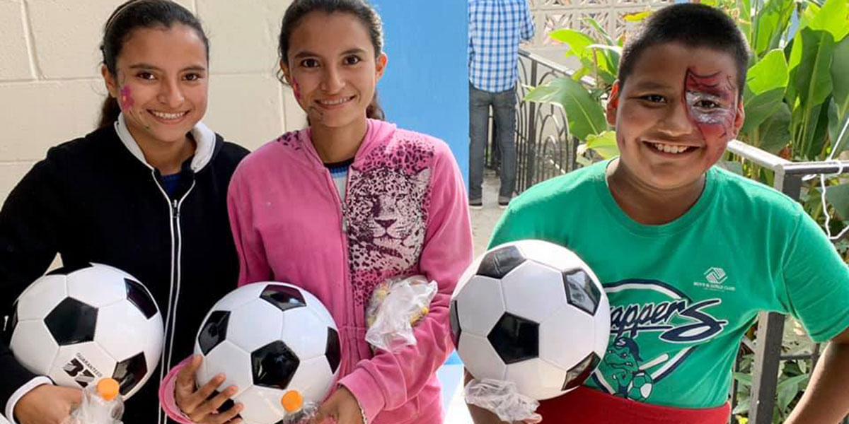 Kids with their new soccer balls at the Christmas fiesta in Reynosa