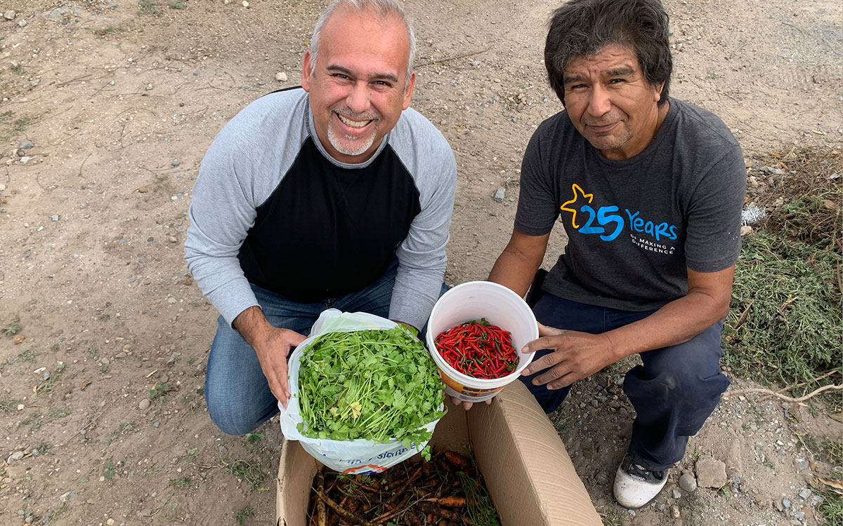 David and our garden caretaker Jose with the new crops from the garden in Mexico