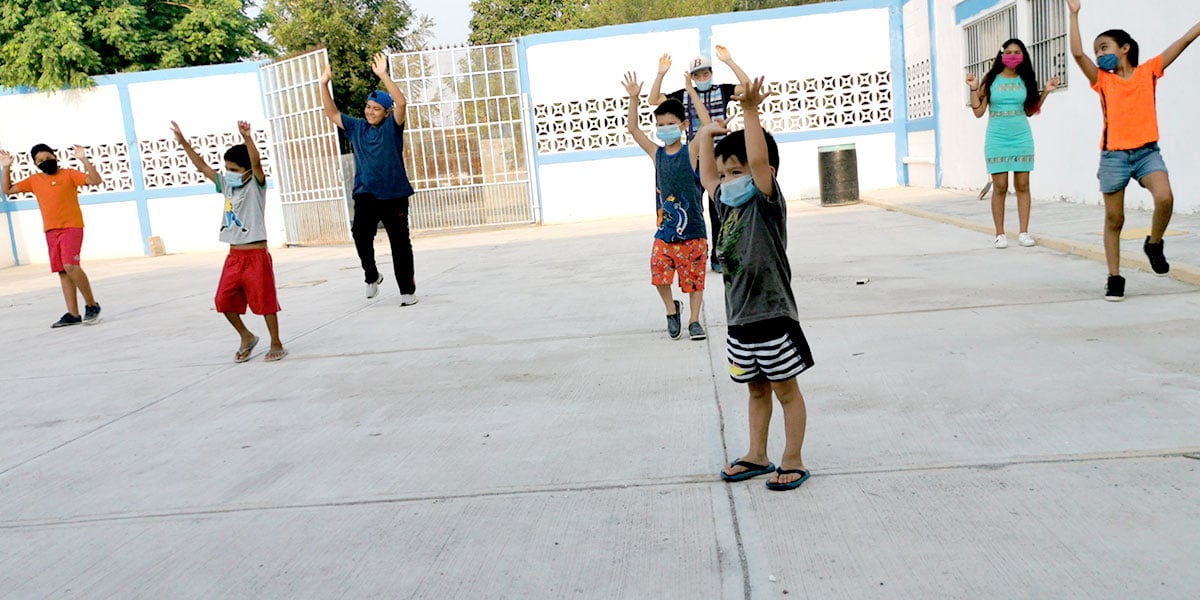 The kids of the children nutrition program singing a song to start the day in Reynosa Mexico