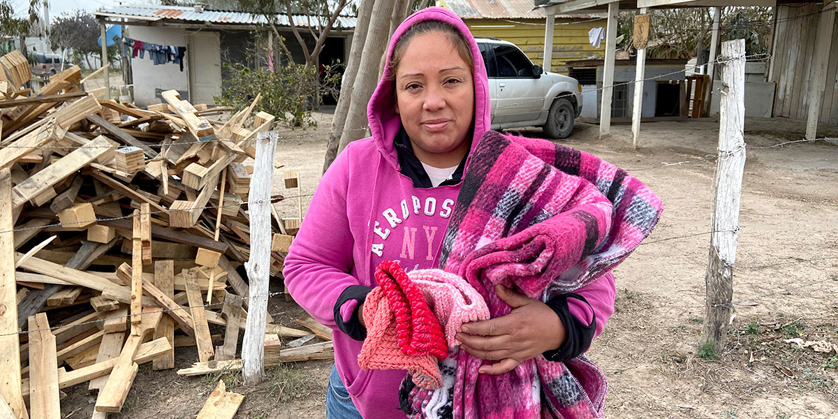 Distributing blankets and hats in Reynosa Mexico