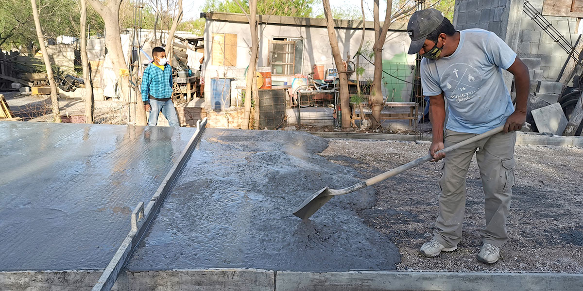 Our staff and volunteers in Reynosa pouring the floor of Casa 2 in Mexico
