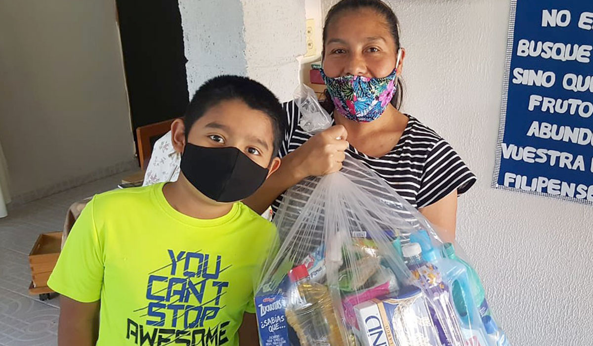 Distributing grocery packages for families in Miguel Aleman Mexico