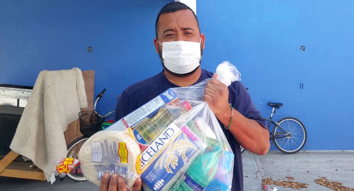 Distributing grocery packages for families in Miguel Aleman Mexico