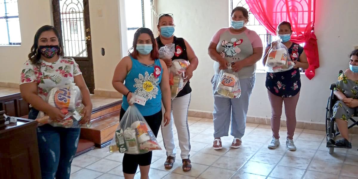Giving out grocery packages to mothers in Miguel Aleman Mexico for Mothers Day
