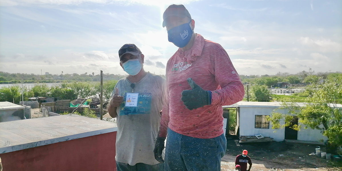 Our Board member Tom with Beto at the roof pour of Casa 3 in Reynosa Mexico