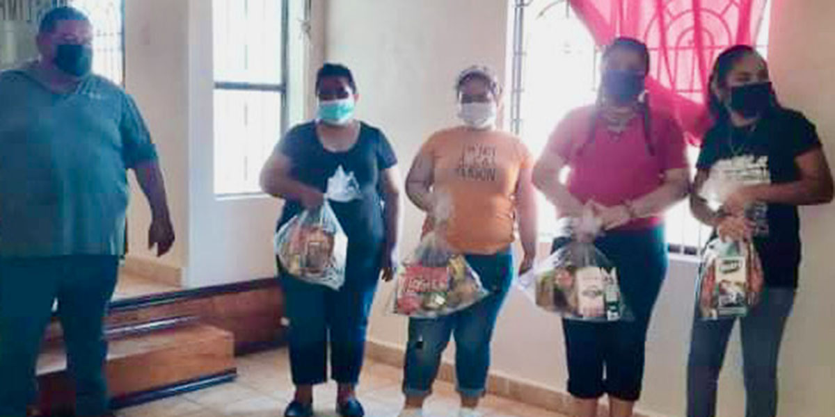 Distributing grocery packages at the church in Miguel Aleman during their celebration for Mexico Independence Day Distributing grocery packages at the church in Miguel Aleman during their celebration for Mexico Independence Day