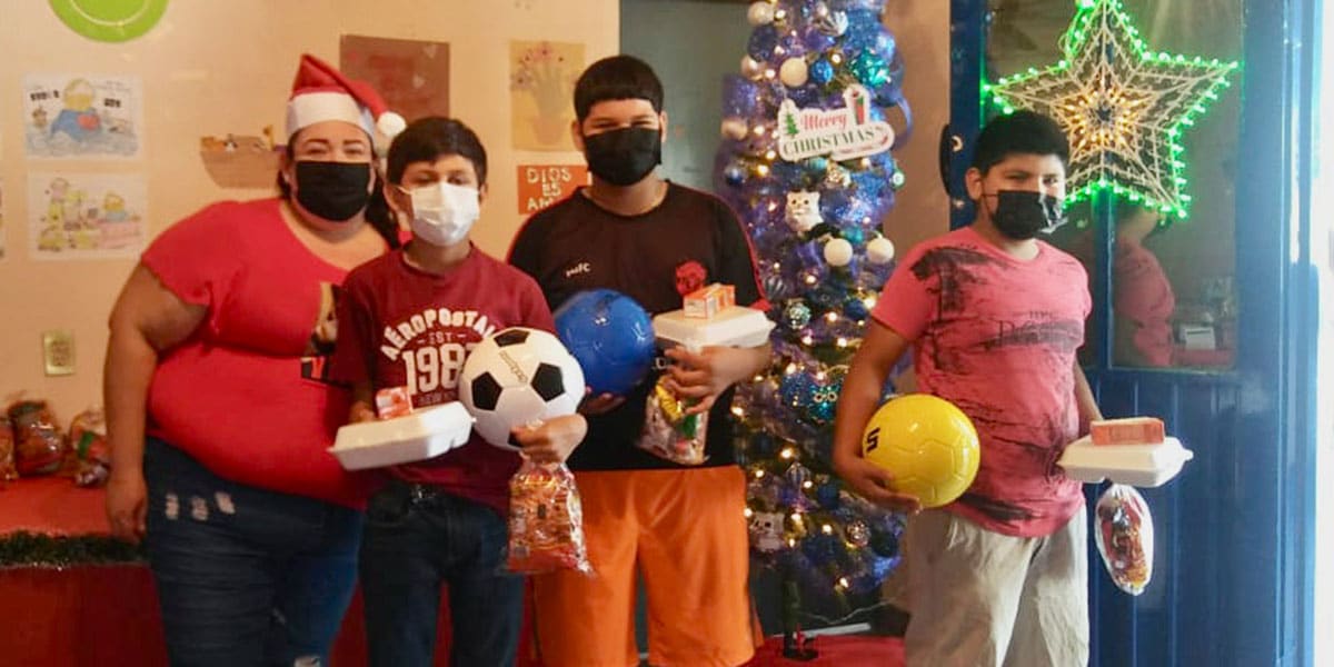 Kids with their toys and meals at the Christmas fiesta for the childres nutrition program in Miguel Aleman Kids with their toys and meals at the Christmas fiesta for the childres nutrition program in Miguel Aleman