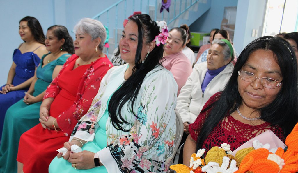 The sewing program graduates in the dresses they sewed themselves in Reynosa Mexico