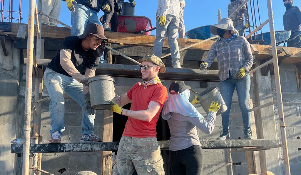 Board member Will helping to pour the roof of the Deantin community center in Mexico