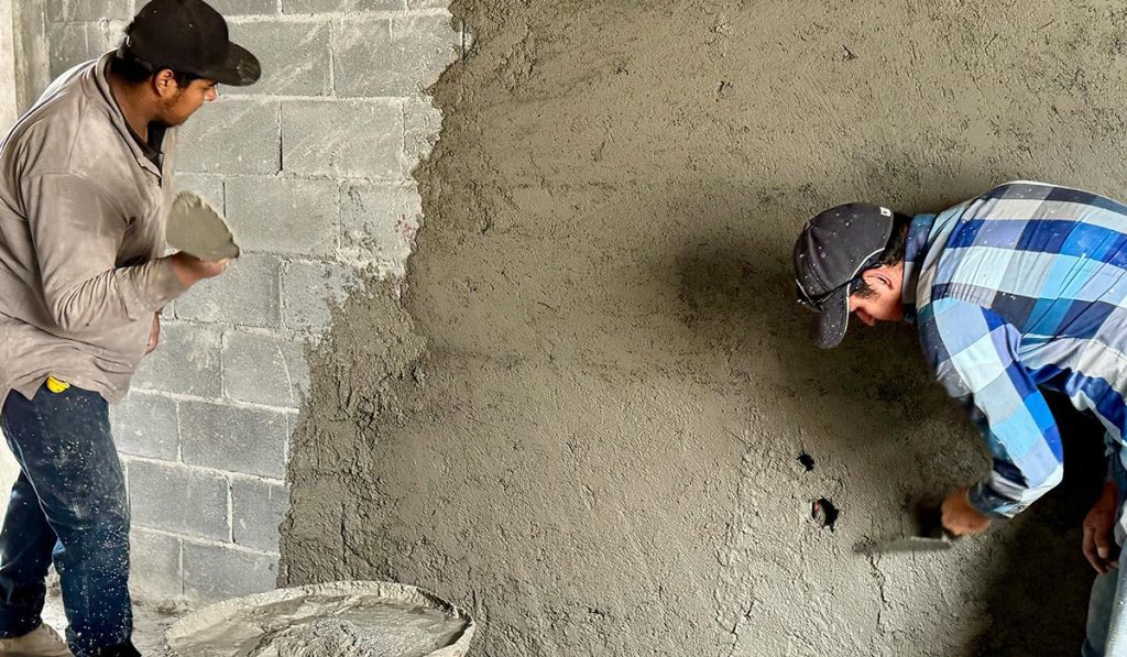 Working hard to stucco the Deantin community center in Naranjito Mexico Working hard to stucco the Deantin community center in Naranjito Mexico