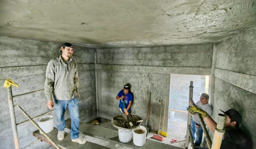 Working hard to stucco the Deantin community center in Naranjito Mexico Working hard to stucco the Deantin community center in Naranjito Mexico