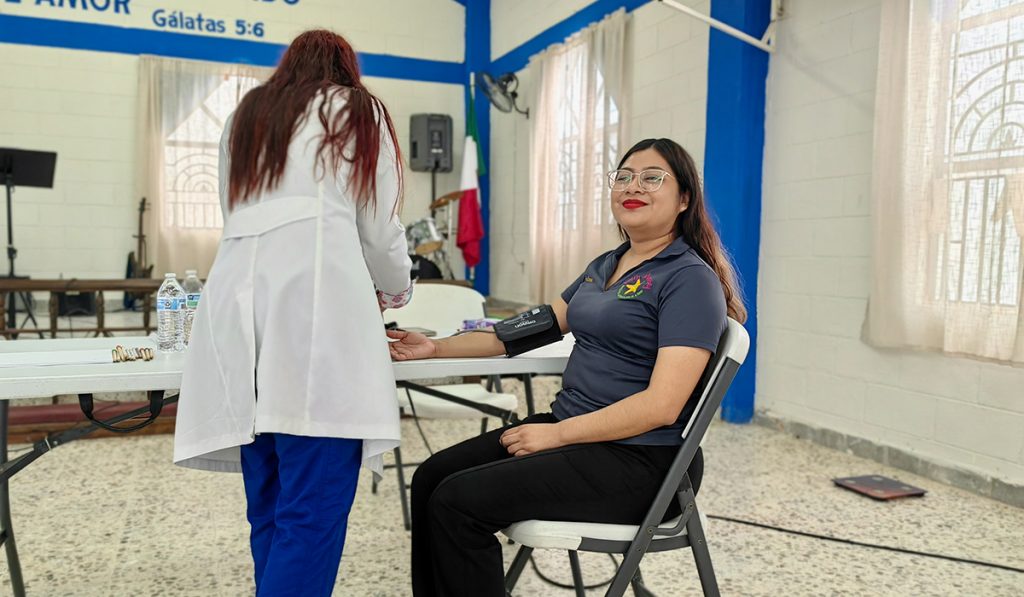 A local nutritionist measuring the blood pressure of our staff in Reynosa Mexico A local nutritionist measuring the blood pressure of our staff in Reynosa Mexico